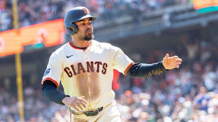 Apr 4, 2025; San Francisco, California, USA; San Francisco Giants first base LaMonte Wade Jr. (31) celebrates after scoring a run during the first inning against the Seattle Mariners at Oracle Park. Apr 4, 2025; San Francisco, California, USA; San Francisco Giants first base LaMonte Wade Jr. (31) celebrates after scoring a run during the first inning against the Seattle Mariners at Oracle Park.