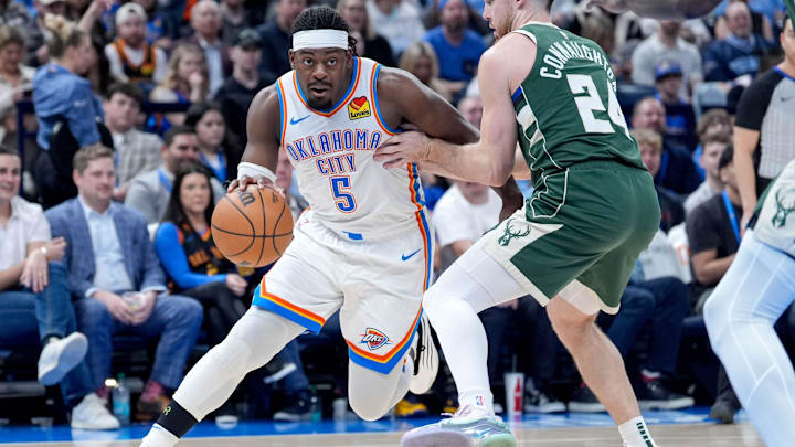 Oklahoma City guard Luguentz Dort (5) drives past Milwaukee guard Pat Connaughton (24) in the second quarter during an NBA game between Oklahoma City and Milwaukee at the Paycom Center in Oklahoma City on Monday, Feb. 3, 2025.
