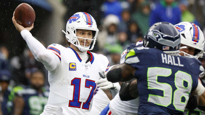 Oct 27, 2024; Seattle, Washington, USA; Buffalo Bills quarterback Josh Allen (17) passes against the Seattle Seahawks during the second quarter at Lumen Field.