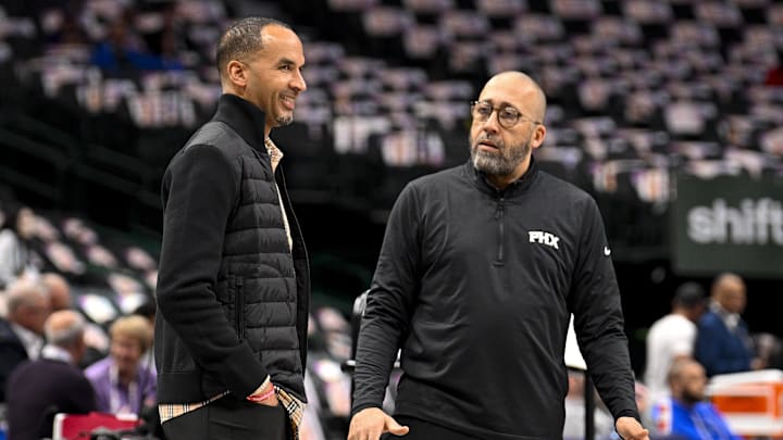 Mar 9, 2025; Dallas, Texas, USA; Dallas Mavericks general manager Nico Harrison (left) speaks with Phoenix Suns assistant coach David Fizdale (right) before the game at the American Airlines Center. Mandatory Credit: Jerome Miron-Imagn Images