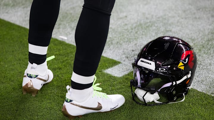 Oct 21, 2024; Glendale, Arizona, USA; Detailed view of the helmet and Nike shoes of Arizona Cardinals quarterback Kyler Murray (1) against the Los Angeles Chargers at State Farm Stadium. Mandatory Credit: Mark J. Rebilas-Imagn Images Oct 21, 2024; Glendale, Arizona, USA; Detailed view of the helmet and Nike shoes of Arizona Cardinals quarterback Kyler Murray (1) against the Los Angeles Chargers at State Farm Stadium. Mandatory Credit: Mark J. Rebilas-Imagn Images