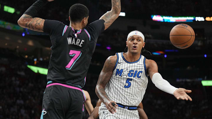 Mar 14, 2026; Miami, Florida, USA; Orlando Magic forward Paolo Banchero (5) passes the ball as he drives to the basket as Miami Heat center Kel'el Ware (7) defends during the first half at Kaseya Center. Mandatory Credit: Jim Rassol-Imagn Images Mar 14, 2026; Miami, Florida, USA; Orlando Magic forward Paolo Banchero (5) passes the ball as he drives to the basket as Miami Heat center Kel'el Ware (7) defends during the first half at Kaseya Center. Mandatory Credit: Jim Rassol-Imagn Images