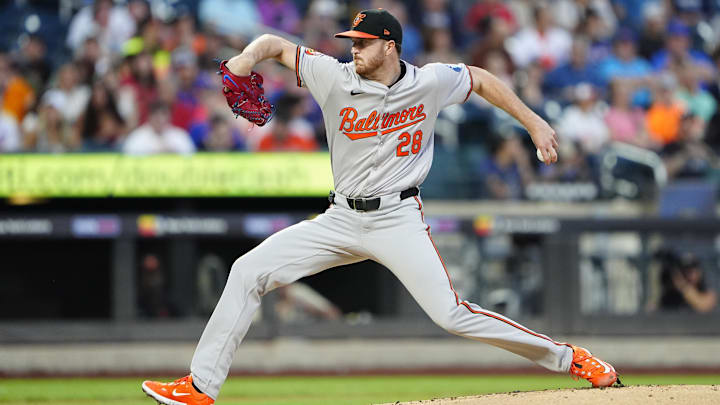 Aug 19, 2024; New York City, New York, USA; Baltimore Orioles pitcher Trevor Rogers (28) delivers a pitch against the New York Mets during the first inning at Citi Field.