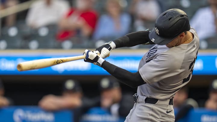 Sep 16, 2025; Minneapolis, Minnesota, USA; New York Yankees left fielder Cody Bellinger (35) hits a RBI single against the Minnesota Twins in the first inning at Target Field. Mandatory Credit: Jesse Johnson-Imagn Images