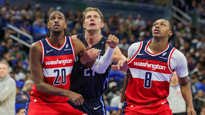 Nov 10, 2024; Orlando, Florida, USA; Washington Wizards forward Alexandre Sarr (20), guard Carlton Carrington (8) and Orlando Magic center Moritz Wagner (21) watch for the rebound during the second half at Kia Center. Mandatory Credit: Mike Watters-Imagn Images