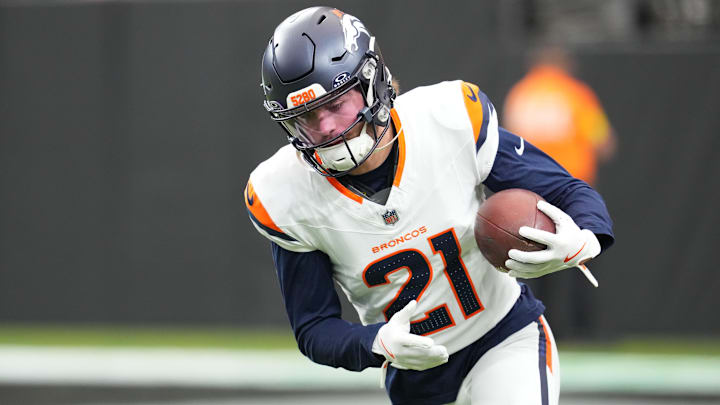 Dec 7, 2025; Paradise, Nevada, USA;  Denver Broncos cornerback Riley Moss (21) warms up prior to a game against the Las Vegas Raiders at Allegiant Stadium. Mandatory Credit: Stephen R. Sylvanie-Imagn Images