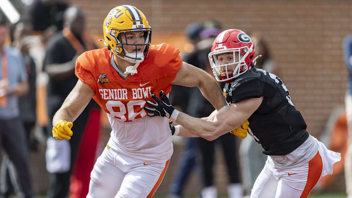 Jan 30, 2025; Mobile, AL, USA; American team tight end Mason Taylor of LSU (86) and American team defensive back Dan Jackson of Georgia (37) spar during Senior Bowl practice for the American team at Hancock Whitney Stadium. Jan 30, 2025; Mobile, AL, USA; American team tight end Mason Taylor of LSU (86) and American team defensive back Dan Jackson of Georgia (37) spar during Senior Bowl practice for the American team at Hancock Whitney Stadium.