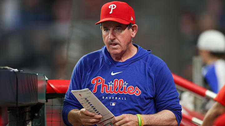 Aug 21, 2024; Atlanta, Georgia, USA; Philadelphia Phillies manager Rob Thomson (59) in the dugout against the Atlanta Braves in the sixth inning at Truist Park