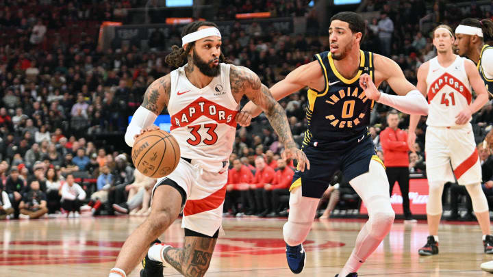 Apr 9, 2024; Toronto, Ontario, CAN; Toronto Raptors guard Gary Trent Jr. (33) dribbles the ball past Indiana Pacers guard Tyrese Haliburton (0) in the first half at Scotiabank Arena. Mandatory Credit: Dan Hamilton-USA TODAY Sports Apr 9, 2024; Toronto, Ontario, CAN; Toronto Raptors guard Gary Trent Jr. (33) dribbles the ball past Indiana Pacers guard Tyrese Haliburton (0) in the first half at Scotiabank Arena. Mandatory Credit: Dan Hamilton-USA TODAY Sports