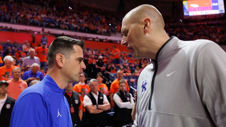 Feb 14, 2026; Gainesville, Florida, USA; Florida Gators head coach Todd Golden and Kentucky Wildcats head coach Mark Pope talk before a game at Exactech Arena at the Stephen C. O'Connell Center. Mandatory Credit: Matt Pendleton-Imagn Images