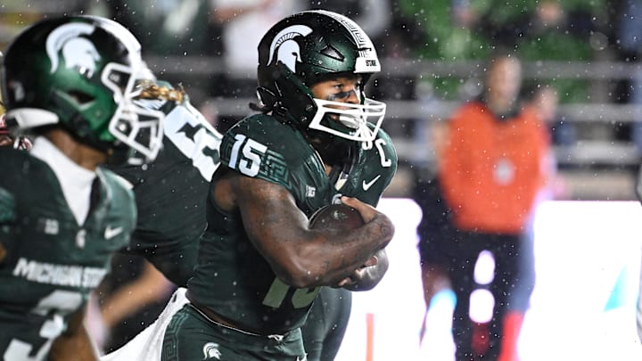 Sep 21, 2024; Chestnut Hill, Massachusetts, USA; Michigan State Spartans running back Kay'Ron Lynch-Adams (15) runs the ball against the Boston College Eagles during the first half at Alumni Stadium. Mandatory Credit: Eric Canha-Imagn Images