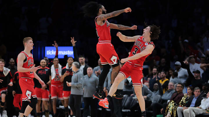 Mar 8, 2025; Miami, Florida, USA; Chicago Bulls guard Josh Giddey (3) celebrates with guard Coby White (0) after scoring against the Miami Heat during the fourth quarter at Kaseya Center. Mandatory Credit: Sam Navarro-Imagn Images