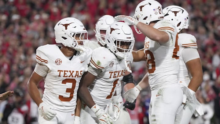 Texas Longhorns wide receiver Ryan Wingo celebrates scoring a touchdown with teammates in the second half against the Georgia Bulldogs at Sanford Stadium.