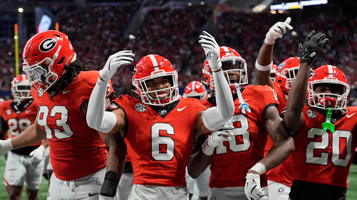 Georgia defensive back Daylen Everette (6) celebrates with his teammates after an interception against Texas during the second half of the 2024 SEC championship game at Mercedes-Benz Stadium in Atlanta. Georgia defensive back Daylen Everette (6) celebrates with his teammates after an interception against Texas during the second half of the 2024 SEC championship game at Mercedes-Benz Stadium in Atlanta.