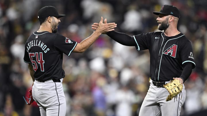 Jul 6, 2024; San Diego, California, USA; Arizona Diamondbacks first baseman Christian Walker (53) and relief pitcher Humberto Castellanos (54) celebrate on the field after defeating the San Diego Padres at Petco Park. Mandatory Credit: Orlando Ramirez-USA TODAY Sports