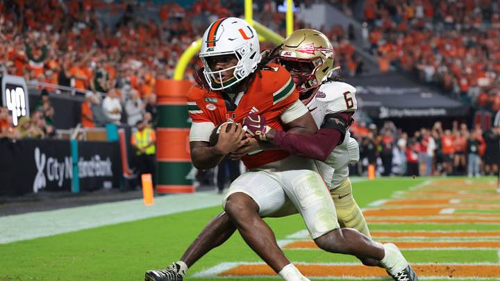 Oct 17, 2026; Miami Gardens, Florida, USA;  Miami Hurricanes wide receiver Malachi Toney (1) catches a touchdown against Florida State Seminoles defensive back Ja'Bril Rawls (6) during overtime at Hard Rock Stadium.  Mandatory Credit: Sam Navarro-Imagn Images