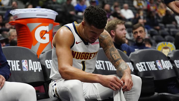 Mar 12, 2025; Denver, Colorado, USA; Denver Nuggets forward Michael Porter Jr. (1) on the bench in the fourth quarter against the Minnesota Timberwolves at Ball Arena. Mandatory Credit: Ron Chenoy-Imagn Images