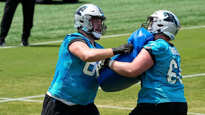 May 12, 2023; Charlotte, NC, USA; Carolina Panthers offensive lineman Nash Jensen (67) in a blocking drill against J.D. Direnzo (65) during the Carolina Panthers rookie camp at the Atrium Practice Facility in Charlotte, NC.Mandatory Credit: Jim Dedmon-Imagn Images