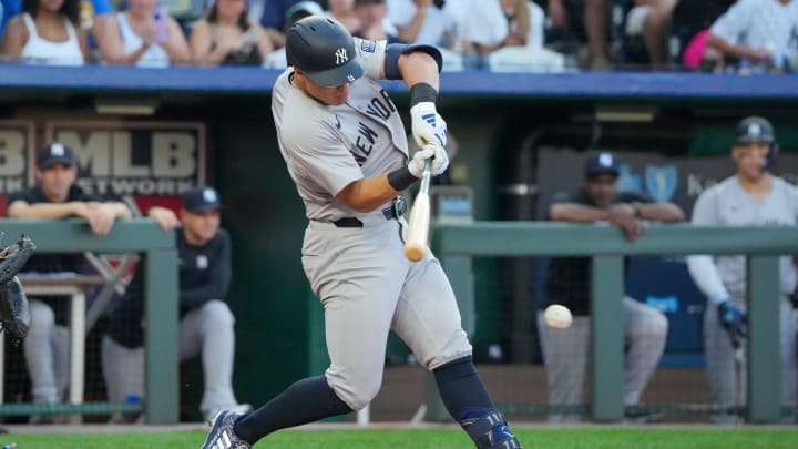 Jun 12, 2024; Kansas City, Missouri, USA; New York Yankees shortstop Anthony Volpe (11) singles against the Kansas City Royals in the first inning  at Kauffman Stadium. 
