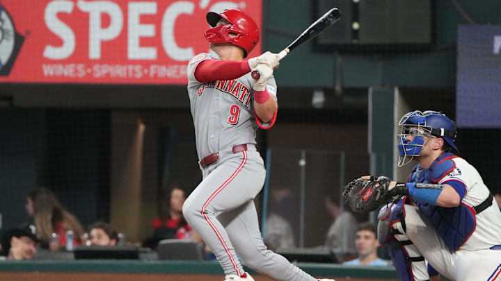 Apr 3, 2026; Arlington, Texas, USA; Cincinnati Reds second baseman Matt McLain (9) follows through on his single against the Texas Rangers during the fifth inning at Globe Life Field. Mandatory Credit: Jim Cowsert-Imagn Images