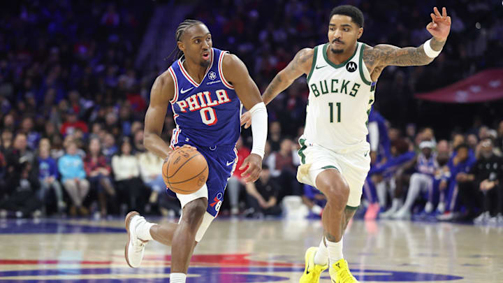 Jan 27, 2026; Philadelphia, Pennsylvania, USA; Philadelphia 76ers guard Tyrese Maxey (0) drives against Milwaukee Bucks guard Gary Harris (11) during the third quarter at Xfinity Mobile Arena. Mandatory Credit: Bill Streicher-Imagn Images