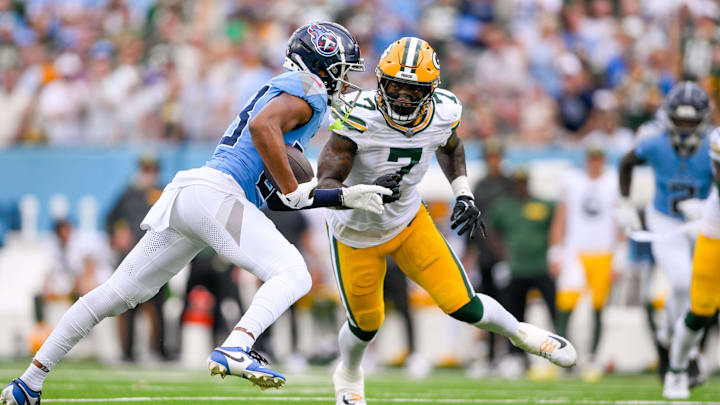 Green Bay Packers linebacker Quay Walker (7) tackles Tennessee Titans wide receiver Tyler Boyd. Green Bay Packers linebacker Quay Walker (7) tackles Tennessee Titans wide receiver Tyler Boyd.