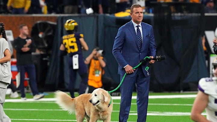Jan 8, 2024; Houston, TX, USA; ESPN analyst  Kirk Herbstreit walks his dog Ben before the 2024 College Football Playoff national championship game between the Michigan Wolverines and the Washington Huskies at NRG Stadium. Mandatory Credit: Kirby Lee-Imagn Images
