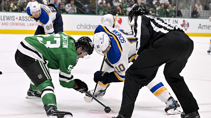 Mar 2, 2025; Dallas, Texas, USA; Dallas Stars center Wyatt Johnston (53) and St. Louis Blues center Brayden Schenn (10) take the face-off during the game between the Dallas Stars and the St. Louis Blues at the American Airlines Center. Mandatory Credit: Jerome Miron-Imagn Images