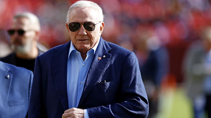 Dallas Cowboys owner Jerry Jones walks off the field before the game between the Washington Commanders and the Dallas Cowboys at Northwest Stadium.