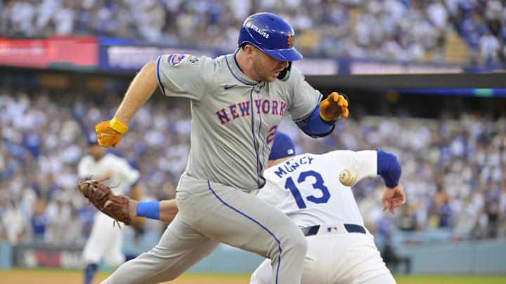 Oct 20, 2024; Los Angeles, California, USA; New York Mets first baseman Pete Alonso (20) runs to second after an error by Los Angeles Dodgers second baseman Chris Taylor (not pictured) to first baseman Max Muncy (13) in the first inning during game six of the NLCS for the 2024 MLB playoffs at Dodger Stadium.