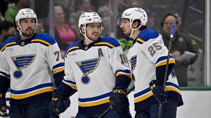 Dec 14, 2024; Dallas, Texas, USA; St. Louis Blues defenseman Justin Faulk (72) and center Robert Thomas (18) and center Jordan Kyrou (25) in action during the game between the Dallas Stars and the St. Louis Blues at American Airlines Center. Mandatory Credit: Jerome Miron-Imagn Images