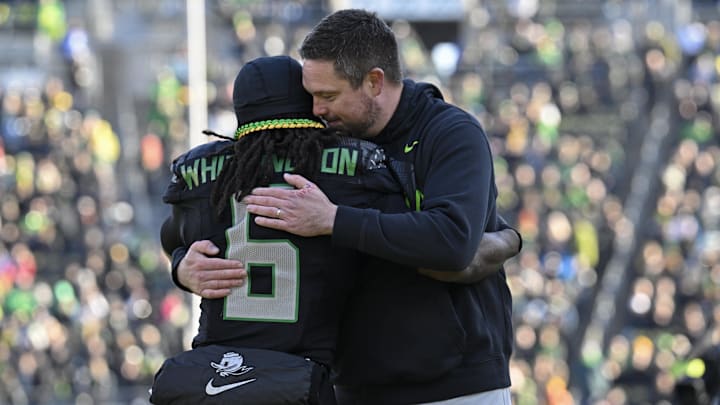 Nov 22, 2025; Eugene, Oregon, USA; Oregon Ducks running back Noah Whittington (6) hugs head coach Dan Lanning before the game against the Southern California Trojans at Autzen Stadium. Mandatory Credit: Troy Wayrynen-Imagn Images