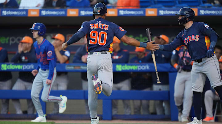 Mar 6, 2025; Port St. Lucie, Florida, USA; Houston Astros infielder Cam Smith (90) celebrates scoring a run with teammate Chas McCormick, right, in the first inning against the New York Mets at Clover Park. Mandatory Credit: Jim Rassol-Imagn Images Mar 6, 2025; Port St. Lucie, Florida, USA; Houston Astros infielder Cam Smith (90) celebrates scoring a run with teammate Chas McCormick, right, in the first inning against the New York Mets at Clover Park. Mandatory Credit: Jim Rassol-Imagn Images