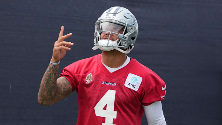 Dallas Cowboys quarterback Dak Prescott enters the field during training camp at the River Ridge Fields.