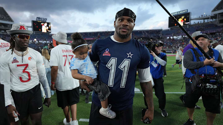 NFC defensive end Micah Parson of the Dallas Cowboys holds his daughter Shatara Parsons after the 2025 Pro Bowl Games.