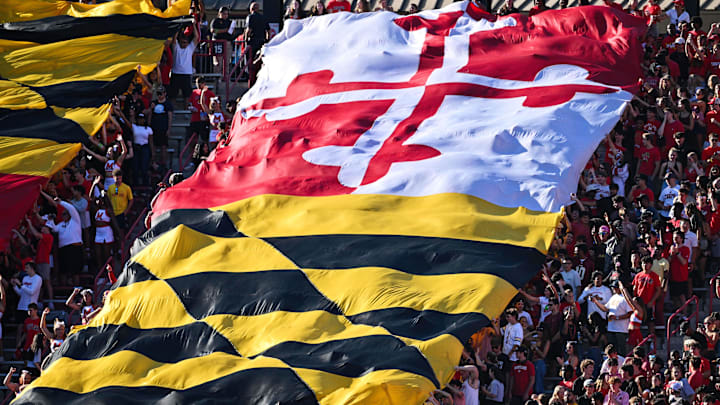 Oct 4, 2025; College Park, Maryland, USA; Fans wave a large Maryland state flag during a NCAA football game between the Maryland Terrapins and the Washington Huskies at SECU Stadium. Oct 4, 2025; College Park, Maryland, USA; Fans wave a large Maryland state flag during a NCAA football game between the Maryland Terrapins and the Washington Huskies at SECU Stadium.