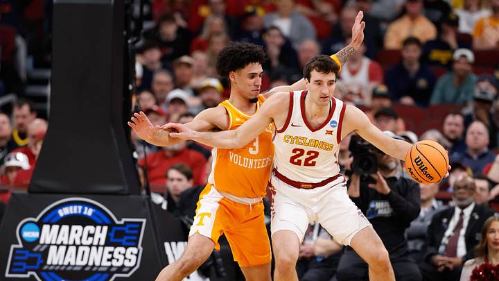 Mar 27, 2026; Chicago, IL, USA; Iowa State Cyclones forward Milan Momcilovic (22) controls the ball while defended by Tennessee Volunteers guard Bishop Boswell (3) in the second half during a Sweet Sixteen game of the Midwest Regional of the men's 2026 NCAA Tournament at United Center. Mandatory Credit: Kamil Krzaczynski-Imagn Images
