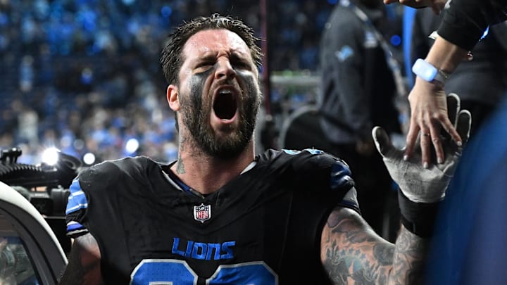 Jan 5, 2025; Detroit, Michigan, USA; Detroit Lions offensive tackle Taylor Decker (68) celebrates with fans as he runs off the field following the Lions win over the Minnesota Vikings at Ford Field. Mandatory Credit: Lon Horwedel-Imagn Images