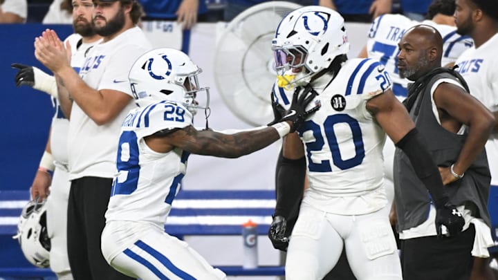 Sep 14, 2025; Indianapolis, Indiana, USA; Indianapolis Colts cornerback Mekhi Blackmon (29) reacts with safety Nick Cross (20) during the fourth quarter at Lucas Oil Stadium. Mandatory Credit: Robert Goddin-Imagn Images