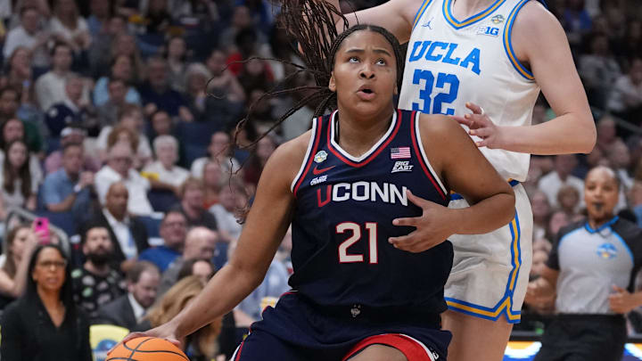 Connecticut Huskies forward Sarah Strong (21) dribbles against UCLA Bruins forward Angela Dugalic (32) during first quarter in a semifinal of the women's 2025 NCAA tournament at Amalie Arena. Mandatory Credit: Kirby Lee-Imagn Images Connecticut Huskies forward Sarah Strong (21) dribbles against UCLA Bruins forward Angela Dugalic (32) during first quarter in a semifinal of the women's 2025 NCAA tournament at Amalie Arena. Mandatory Credit: Kirby Lee-Imagn Images