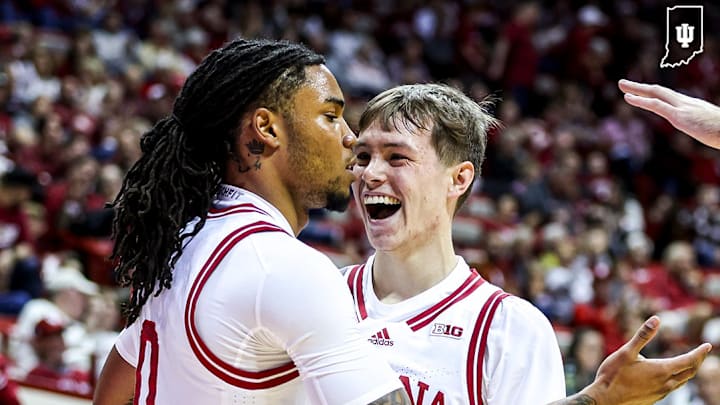 Indiana guard Jakai Newton celebrates scoring his first basket as a Hoosier with Gabe Cupps.