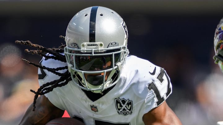 Sep 15, 2024; Baltimore, Maryland, USA; Las Vegas Raiders wide receiver Davante Adams (17) runs with the ball as Baltimore Ravens cornerback Marlon Humphrey (44) defends during the second half at M&T Bank Stadium. Mandatory Credit: Reggie Hildred-Imagn Images