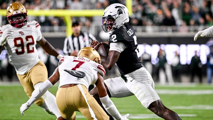 Michigan State's Aidan Chiles, right, runs for a gain as Boston College's Carter Davis closes in during the fourth quarter on Saturday, Sept. 6, 2025, at Spartan Stadium in East Lansing. Michigan State's Aidan Chiles, right, runs for a gain as Boston College's Carter Davis closes in during the fourth quarter on Saturday, Sept. 6, 2025, at Spartan Stadium in East Lansing.