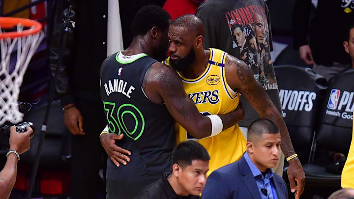 Apr 30, 2025; Los Angeles, California, USA; Minnesota Timberwolves forward Julius Randle (30) meets with Los Angeles Lakers forward LeBron James (23) following game five of first round for the 2025 NBA Playoffs at Crypto.com Arena. Mandatory Credit: Gary A. Vasquez-Imagn Images