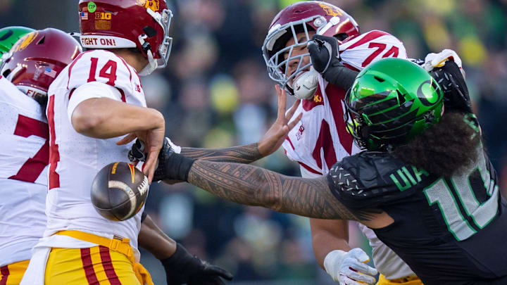 Oregon outside linebacker Matayo Uiagalelei, right, forces a fumble from USC quarterback Jayden Maiava as the Oregon Ducks host the USC Trojans on Nov. 22, 2025, at Autzen Stadium in Eugene, Oregon.