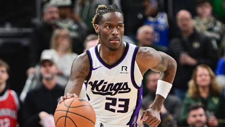 Jan 14, 2025; Milwaukee, Wisconsin, USA;  Sacramento Kings guard Keon Ellis (23) brings the ball down court in the second quarter against the Milwaukee Bucks at Fiserv Forum. Mandatory Credit: Benny Sieu-Imagn Images