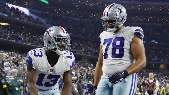 Dec 4, 2022; Arlington, Texas, USA; \h12\ and offensive tackle Terence Steele (78) celebrate a