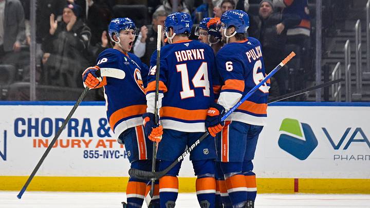 Dec 9, 2025; Elmont, New York, USA; New York Islanders center Bo Horvat (14) celebrates his goal with defenseman Ryan Pulock (6) and defenseman Matthew Schaefer (48) against the Vegas Golden Knights during the first period at UBS Arena. Mandatory Credit: Dennis Schneidler-Imagn Images Dec 9, 2025; Elmont, New York, USA; New York Islanders center Bo Horvat (14) celebrates his goal with defenseman Ryan Pulock (6) and defenseman Matthew Schaefer (48) against the Vegas Golden Knights during the first period at UBS Arena. Mandatory Credit: Dennis Schneidler-Imagn Images