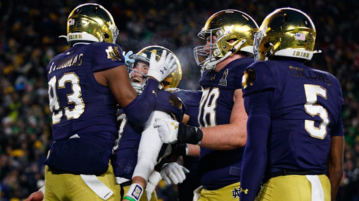 Notre Dame wide receiver Jayden Thomas (83) and quarterback Riley Leonard (13) celebrate a Thomas touchdown during the first round of the College Football Playoff between Notre Dame and Indiana on Friday, Dec. 20, 2024, in South Bend. Notre Dame wide receiver Jayden Thomas (83) and quarterback Riley Leonard (13) celebrate a Thomas touchdown during the first round of the College Football Playoff between Notre Dame and Indiana on Friday, Dec. 20, 2024, in South Bend.