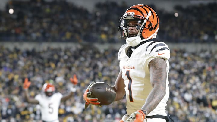 Jan 4, 2025; Pittsburgh, Pennsylvania, USA;  Cincinnati Bengals wide receiver Ja'Marr Chase (1) reacts after catching a touchdown pass against the Pittsburgh Steelers  during the first quarter at Acrisure Stadium. Mandatory Credit: Charles LeClaire-Imagn Images